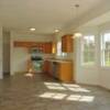 The kitchen and breakfast area has a very nice vinyl floor that gives the look of tile without the cost.