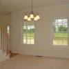 Dinning room has crown molding and chair rail.