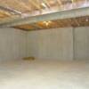 This basement (like all RA basements) use Metwood Beams to eliminate support columns.  The basement is heated.
